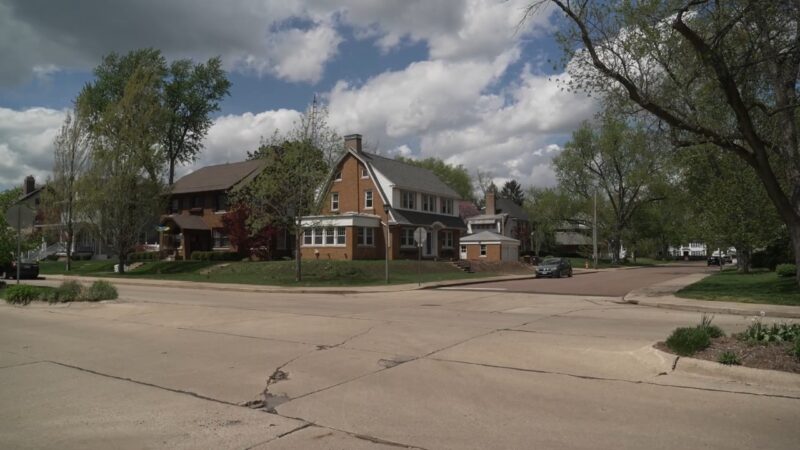 Residential Street in Peoria Showcasing Family Homes with Lush Greenery on A Sunny Day